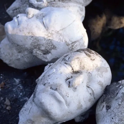 Casts of heads by a well, Wat Umong, Chiang Mai