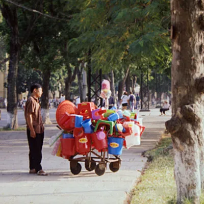 Street seller getting his picture taken, Hanoi